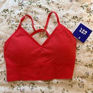 Coral / red woman’s sports bra